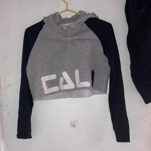 Cropped sweater says Cali on the fort